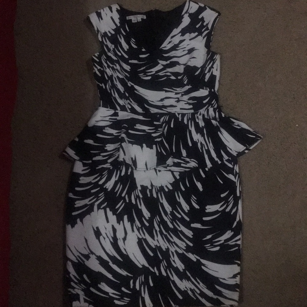 Black and white peplum fitted dress